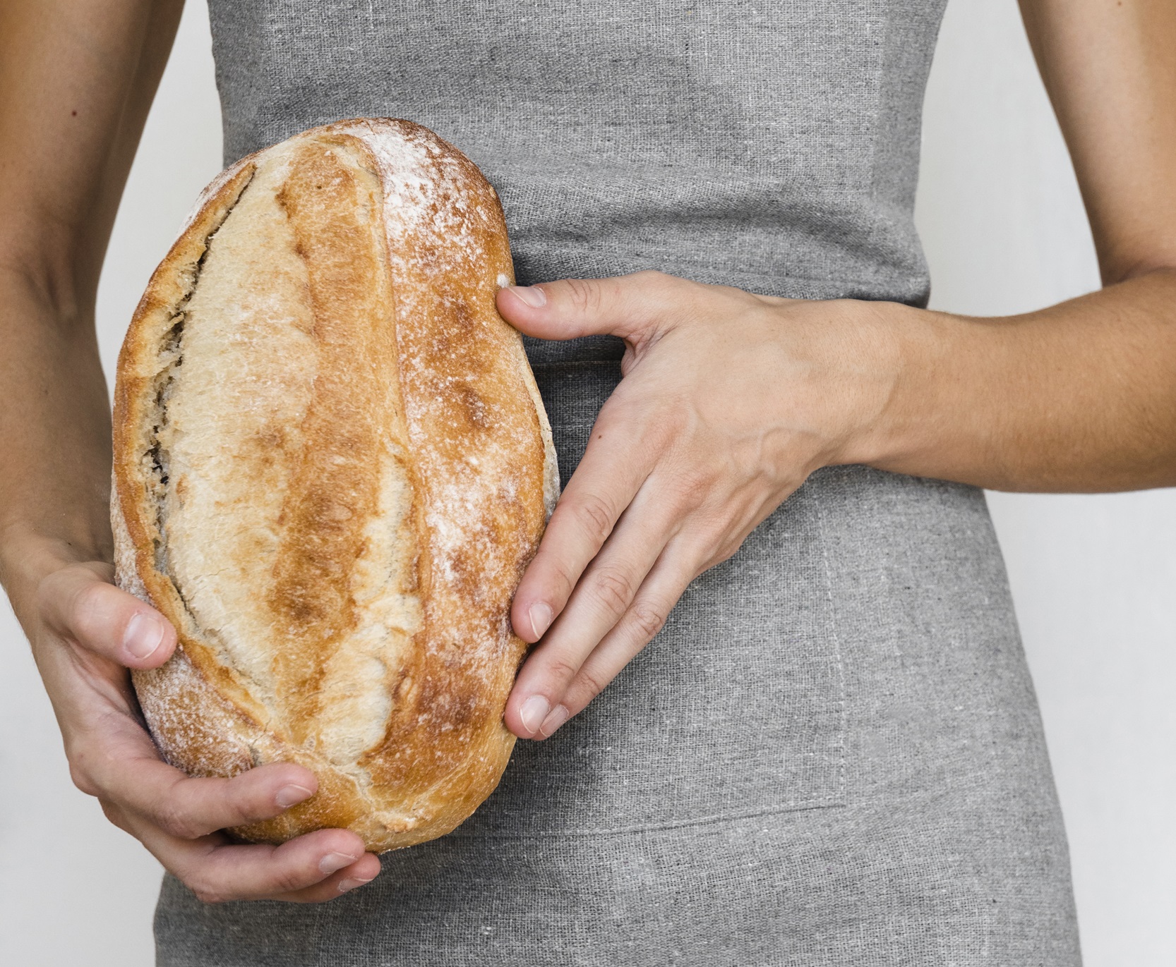 person-holding-bread-loaf