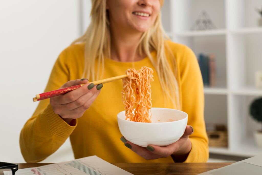 close-up-adult-woman-eating-noodles