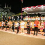 Badun Adi Arnawa dan istri saa membuka Turnamen Bola Voli Porgana Cup IV Tahun 2026 di Lapangan Porgana, Banjar Gunung Pande, Desa Tumbak Bayuh, Mengwi, Jumat (27/3).